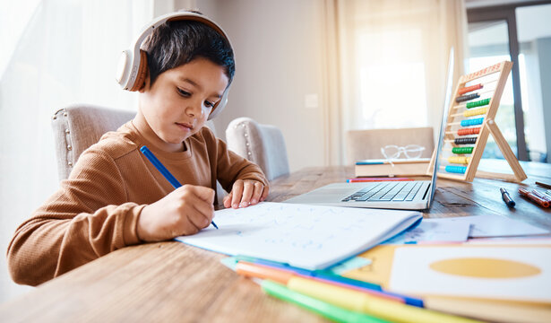 Learning headphones, math education and kid in home with book for studying, homework or homeschool. Development, laptop or boy or child with notebook for numbers in elearning, virtual or online class