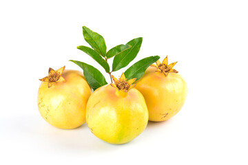 Ripe yellow pomegranates on white background