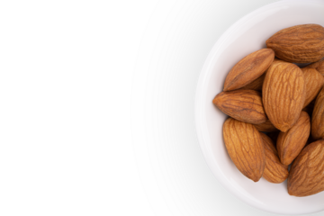 Beautiful big raw peeled almonds laying in the small bowl on  white background. View close to object with copyspace.  Side copy space for text. Horizontal Orientation. Healthy food concept. png