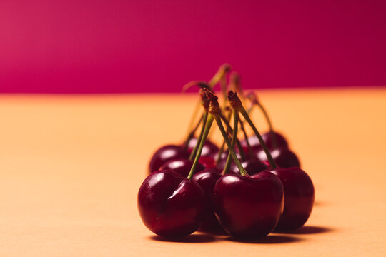 seasonal red fruits on a background of the same color