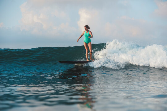 Surfer woman on a wave