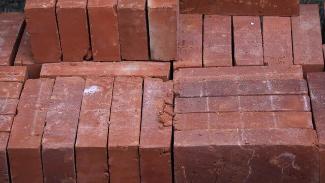 Temanggung, Indonesia - September 2022 : Stacks of red bricks arranged horizontally and vertically. Perfect for background, film, documentation, education, ect.
