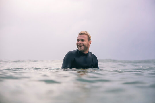 Smilling male surfer