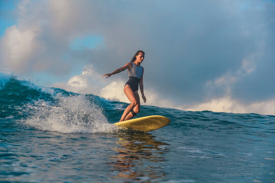 Female surfer on a wave