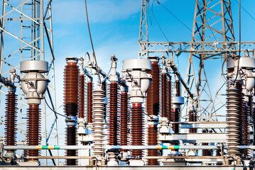 High voltage circuit breaker in a power substation.Electric power transmission lines in the evening. High voltage switchgear and equipment of power plant.