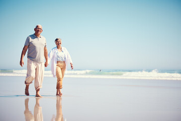 Holding hands, summer and an old couple walking on the beach with a blue sky mockup background....