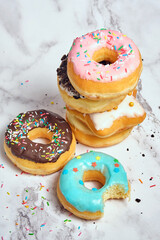 several different donuts on a white background