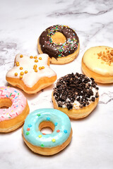 several different donuts on a white background