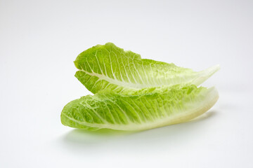 Fototapeta na wymiar Fresh green romaine lettuce on a wooden background 