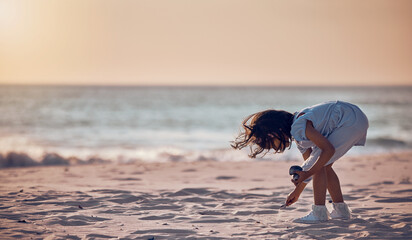 Mockup, girl and beach for summer vacation, sand and search for seashells, happiness and water. Female child, kid and young person on seaside holiday, collection or freedom with peace, relax or break