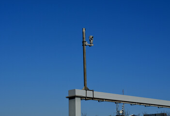 there is a row of halogens on the pole above the sports ground for the night use of the sports...