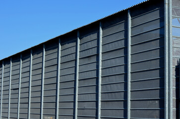 steel cladding of a building with a expanded metal lattice structure. galvanized gray nets protect...