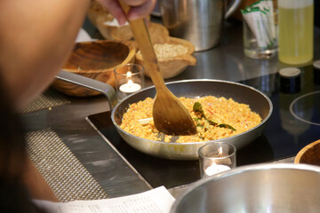 Preparation of vegan tofu scramble in cooking pan