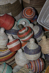 Senegalese baskets sold in village market in Senegal, Africa. Traditional national handicraft, craft in Senegal, Africa. Ethnic ornament. Ornamental basket. Shop, market in Senegal. Decorative basket