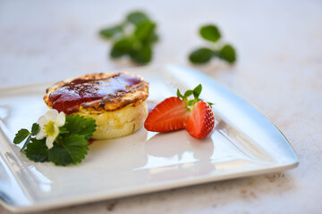 Soufflee with strawberries on the plate