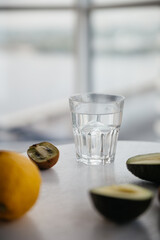 glass on table, kiwi, lemon