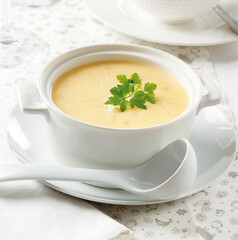 bowl with cheese soup decorated with parsley