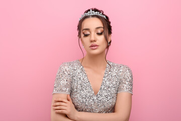 Beautiful young woman wearing luxurious tiara on pink background - obrazy, fototapety, plakaty