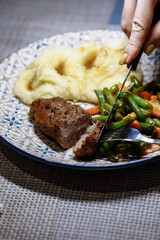 Potatoes with fish sauce and vegetables