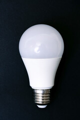 White light bulb and word idea on gray background