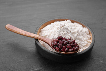 Kidney bean flour and seeds on black table