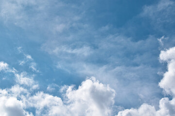Blue sky with white fluffy clouds.  Photo can be used for the concepts of Freedom of life, New life beginning and Positive energy.