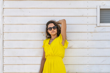 woman in yellow dress on beach