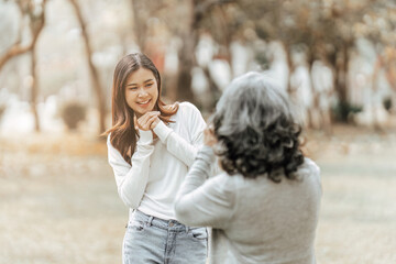 Fototapeta premium Portrait of an adult daughter with her elderly mother and take a photo and happy moment