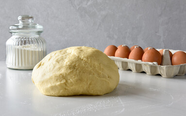 dough, flour and eggs on the table