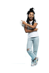 Full length image of young brunette woman wearing casual clothes smiling and pointing finger at copyspace isolated on a transparent background
