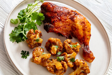 baked chicken leg with spicy roast cauliflower