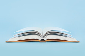 book with hard cover on blue background