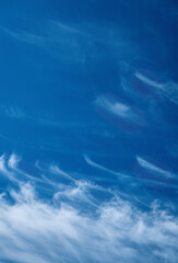 Blue sky background with cirrus clouds