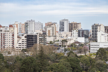 Fototapeta na wymiar View of Caxias do Sul city center with Macaquinhos Park and tall buildings; Rio Grande do Sul, Brazil
