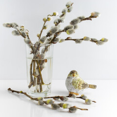 willow branches in a glass on a white background