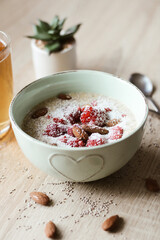 Oatmeal and milk with fruit and almonds.  Excellent healthy and delicious breakfast 