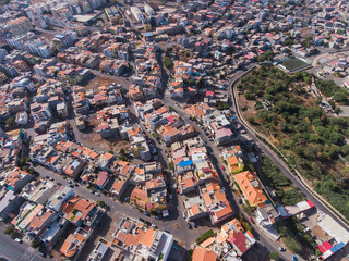 Obraz premium Aerial photos of Praia, the capital city of Santiago Island, Cabo Verde, reveal a bustling metropolis with a vibrant culture, stunning architecture, and breathtaking views of the Atlantic Ocean.