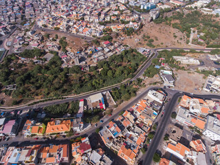 Obraz premium Aerial photos of Praia, the capital city of Santiago Island, Cabo Verde, reveal a bustling metropolis with a vibrant culture, stunning architecture, and breathtaking views of the Atlantic Ocean.
