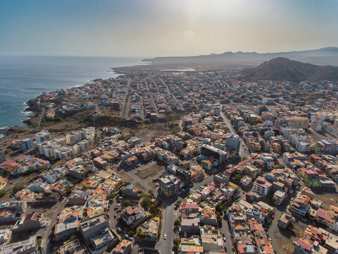 Aerial photos of Praia, the capital city of Santiago Island, Cabo Verde, reveal a bustling metropolis with a vibrant culture, stunning architecture, and breathtaking views of the Atlantic Ocean.