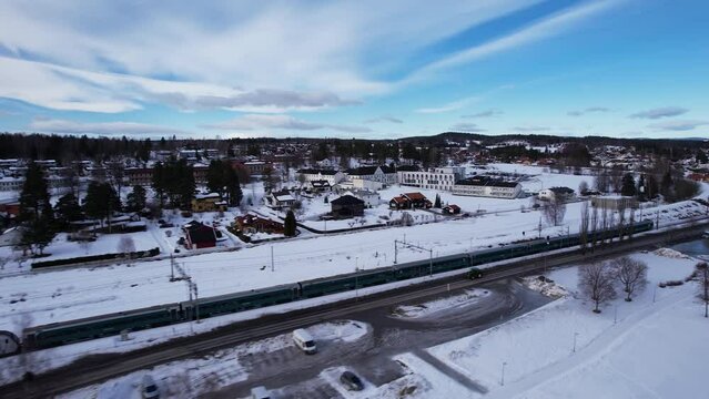 Train passing the beautiful small town Vikersund in Norway.