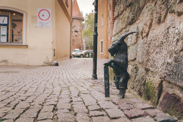 Obraz na płótnie Canvas Sculpture of a goat near the Krakow Gate in Lublin