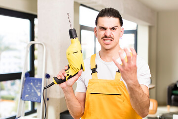 young handsome man handyman or housekeeper concept at home interior