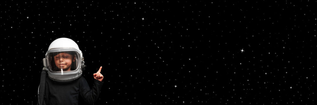 child wants to fly an airplane wearing an airplane helmet