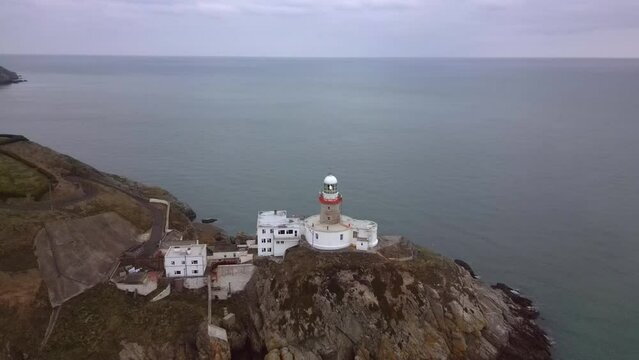  A lighthouse located in Howth, Dublin, Ireland. Recorded by drone just after sunrise.