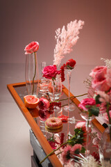 Beautiful flowers on the mirror table 