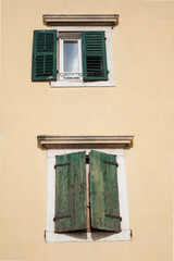 Windows with old shutters in the ancient Croatian city of Sibenik.