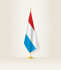 Luxembourg flag on a flag stand.