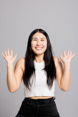 Delighted happy surprised woman in basic clothes looking at camera with shoked opening mouth