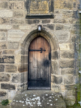 Arched door to ancient gothic church