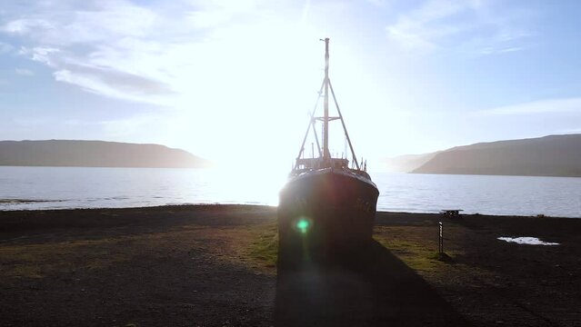 The oldest boat Gardar BA 64 in North West Iceland at sunset